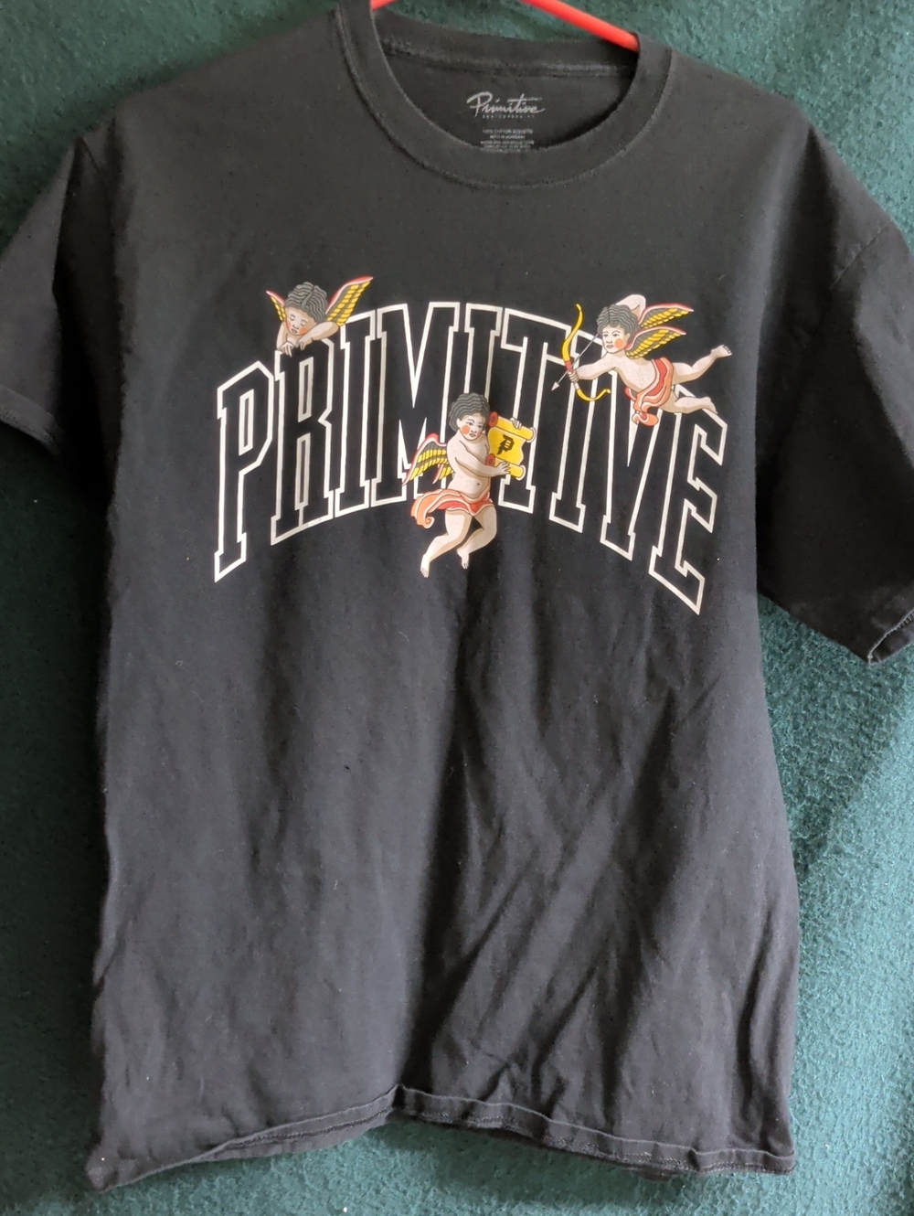 Primitive Black Tee with Cherub Graphic and White Logo